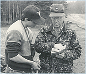 Photo of Pete Edwards speaking to another person